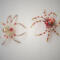 Golden and red beaded spider sculptures featuring fiery accents, copper-toned beads, and elegant handmade wirework.